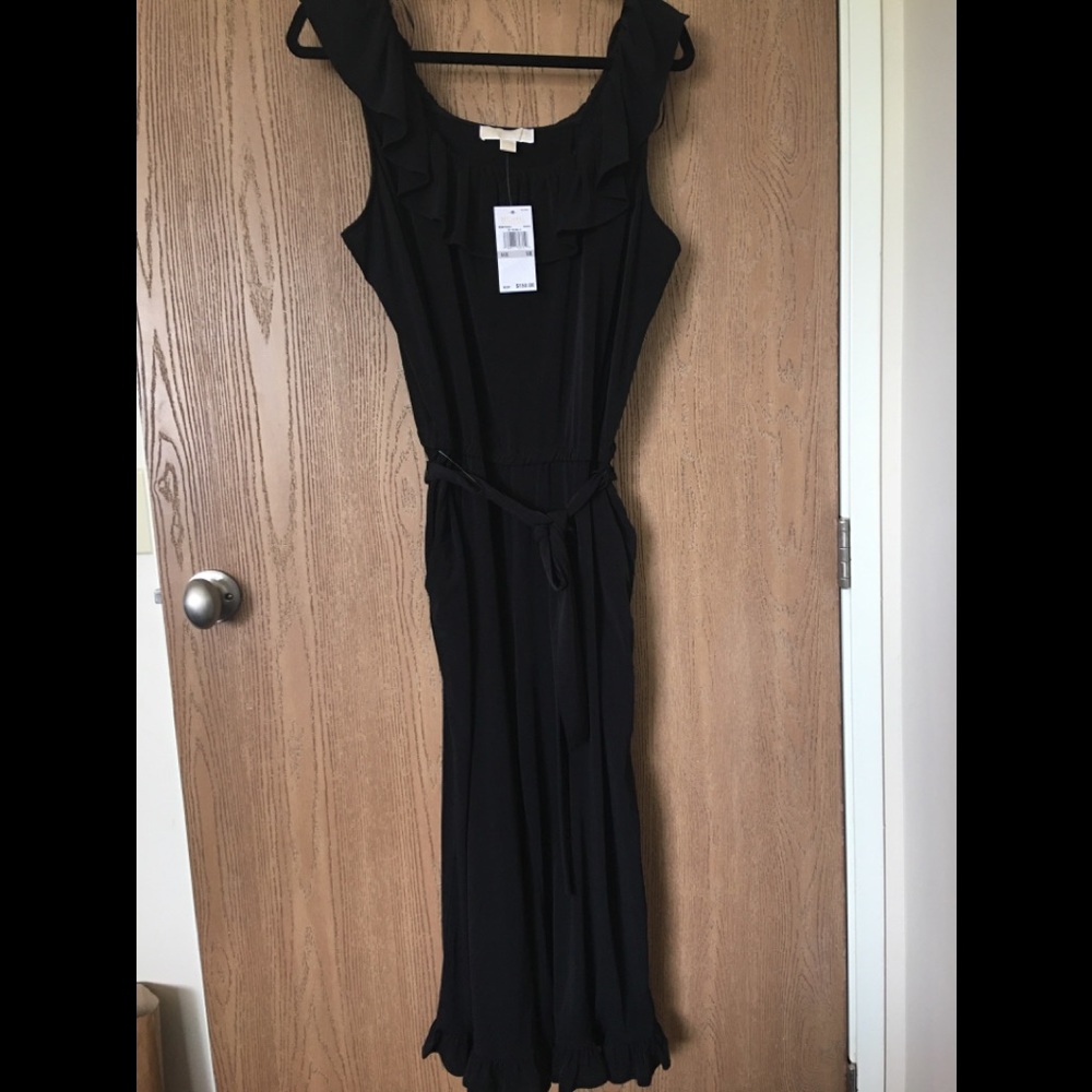 NWT Michael Kors black ruffled jumpsuit. Size 1X.